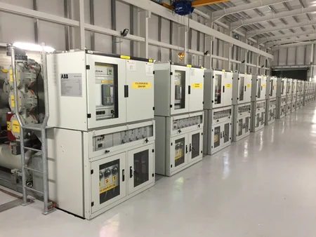 Inside the Kilpaddoge 220/110kV substation by Eirgrid, featuring large transformers and circuit breakers.