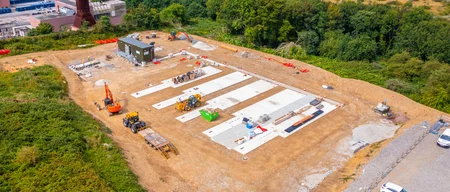 Overlooking shot of construction site of BESS 1 Battery storage plant undergoing civil works.