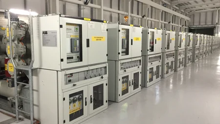 Inside the Kilpaddoge 220/110kV substation by Eirgrid, featuring large transformers and circuit breakers.